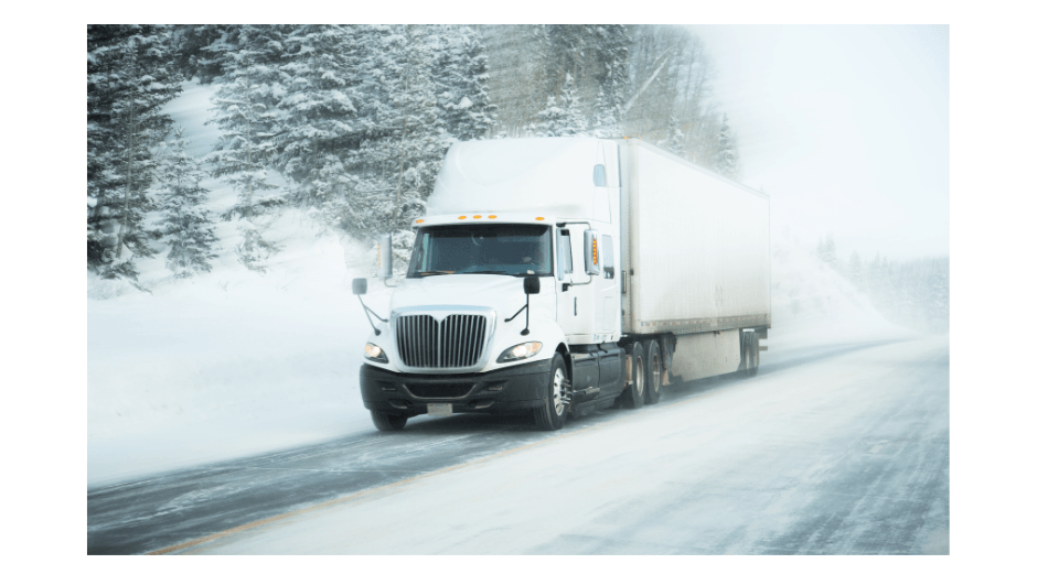 Semi Truck driving in snowy weather